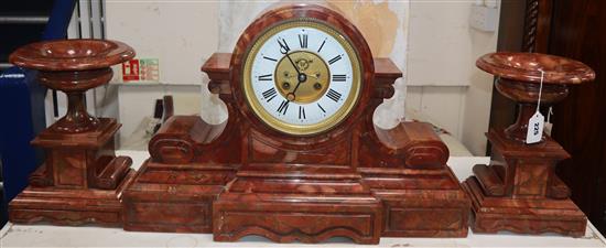 A 19th century rouge marble clock garniture height 42cm